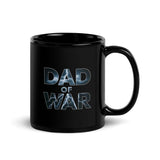 Black ceramic mug featuring 'Dad of War' design with letters shaped like lightning bolts on a dark backdrop.